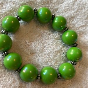 Garold Miller stretch bracelet with silver separators. Incandescent Kelly green